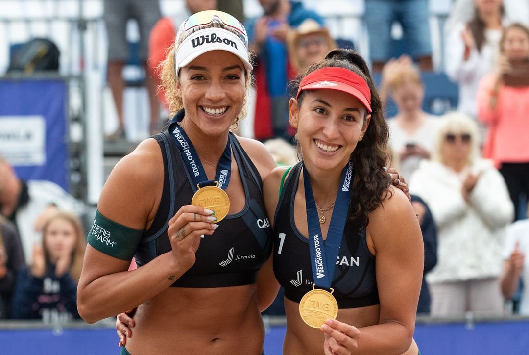 Pictured is Brandie Wilkerson, left, and Melissa Humana-Paredes, right, smiling with their gold medals at the Beach Pro Tour Challenge in Jurmala, Latvia on Sunday June 18, 2023.