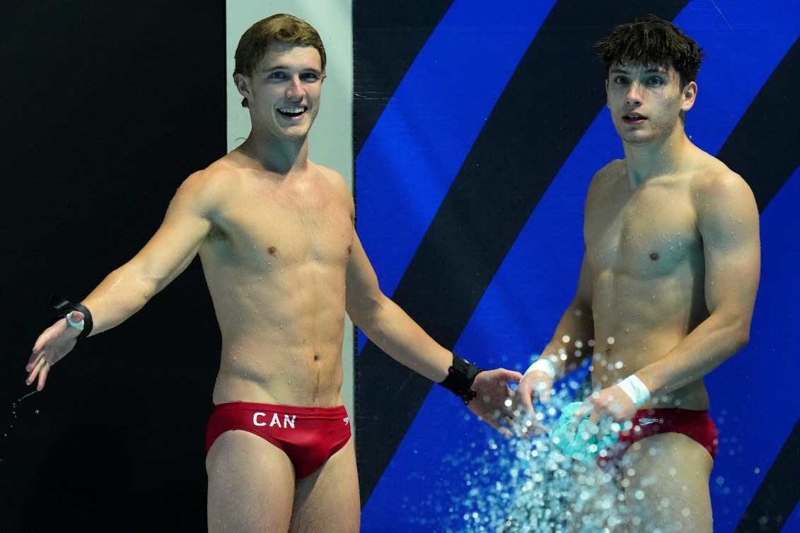 Rylan Wiens and Nathan Zsombor-Murray smile after seeing their scores