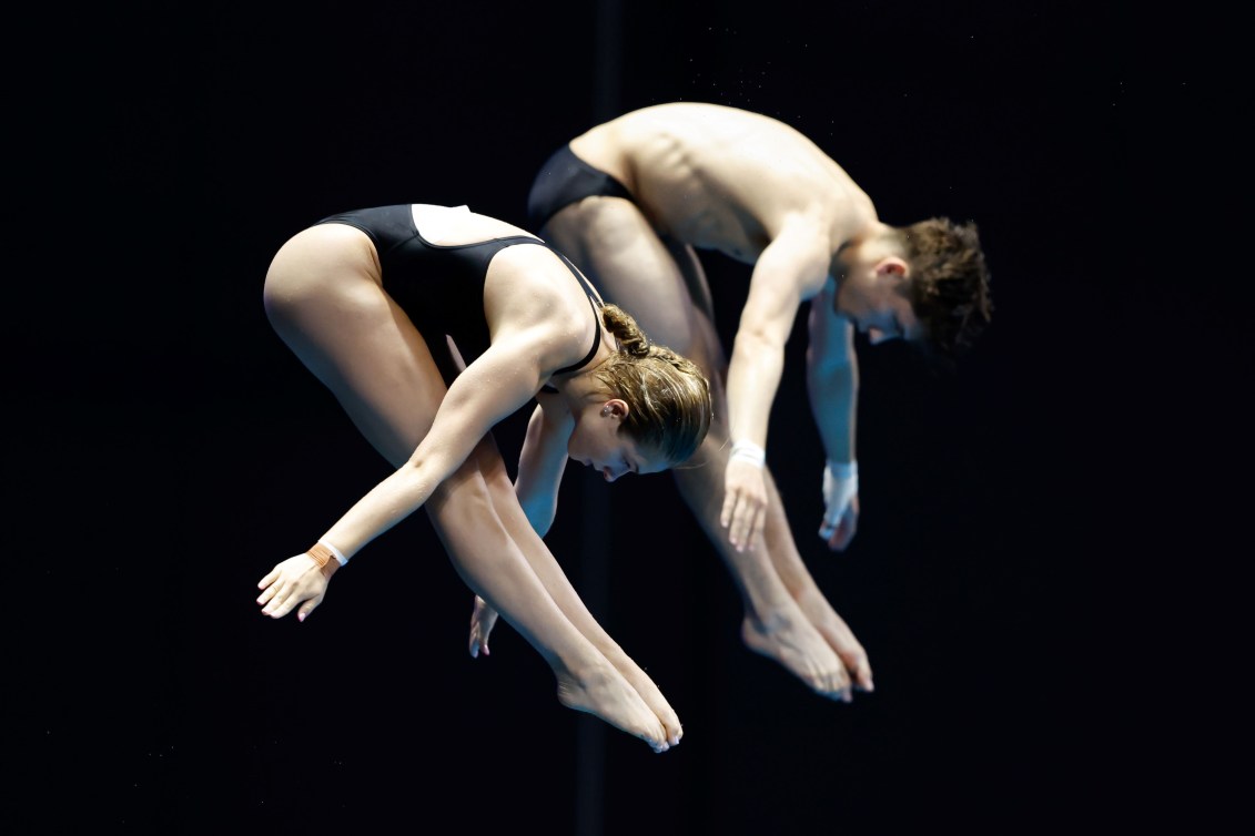 Nathan Zsombor-Murray and Kate Miller in pike position as they dive 