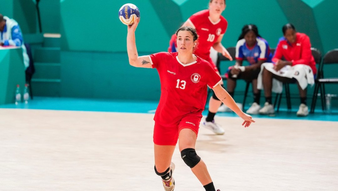 Handball player winds up to throw