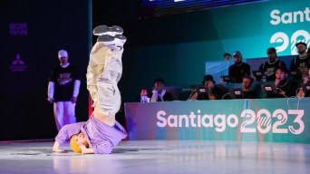 Breaker B-Girl Tiff is inverted while performing at the Pan Am Games