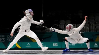 Two fencers duel, one steps forward while the other squats low