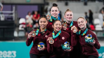 Team Canada's women's artistic gymnastics team poses with their bronze medals at the Santiago 2023 Pan Am Games