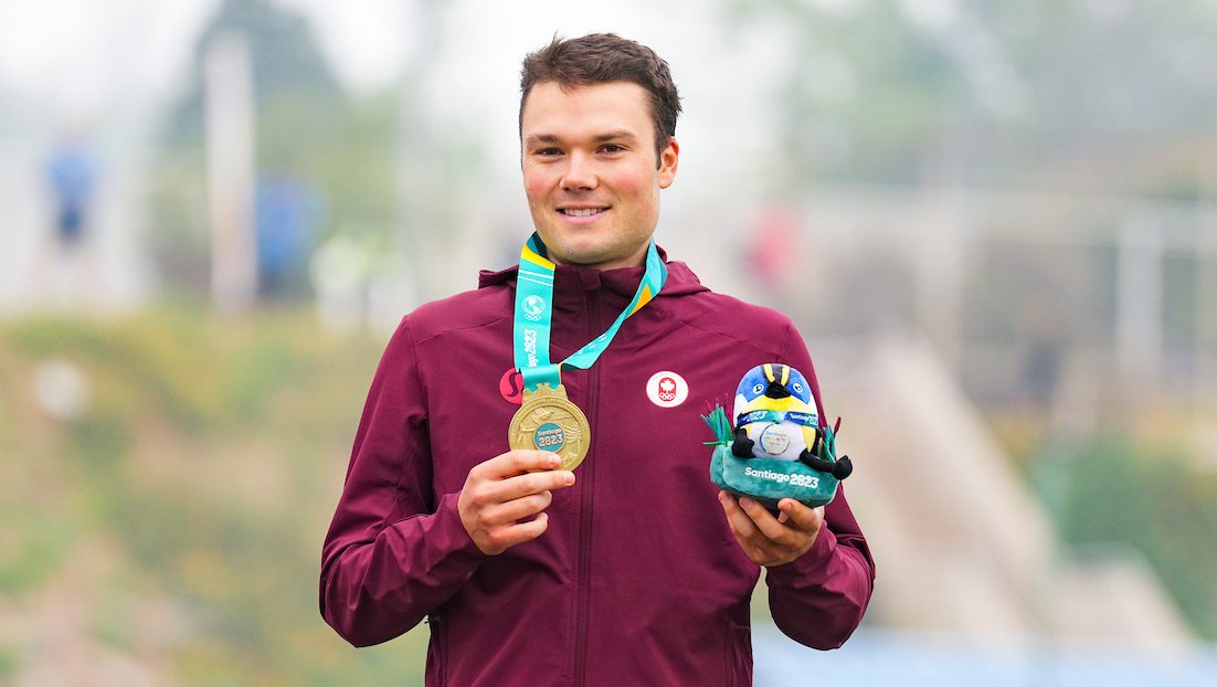 Gunnar Holmgren wears his gold medal on the podium