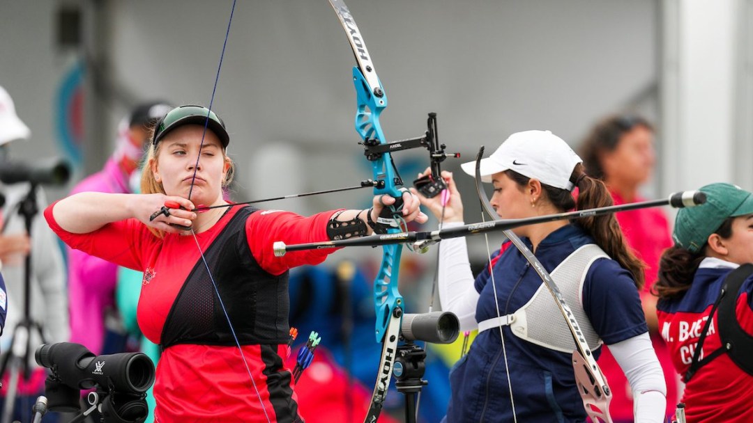 Amelia Gagne takes aim with her bow