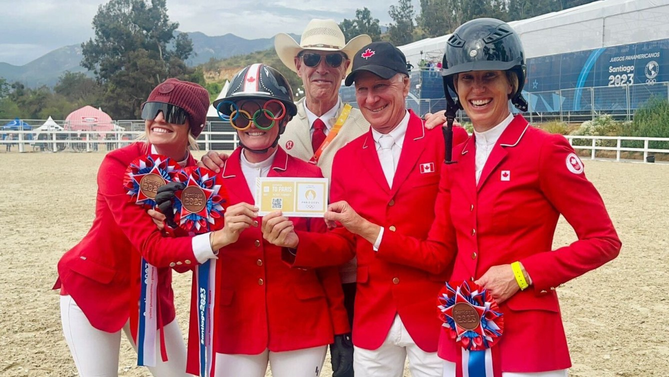 Four equestrians in red jackets hold a golden ticket for the Paris 2024 Olympic Games