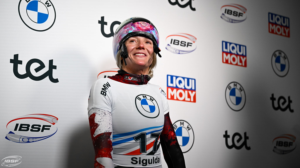 Mirela Rahneva smiles with her helmet perched atop her head