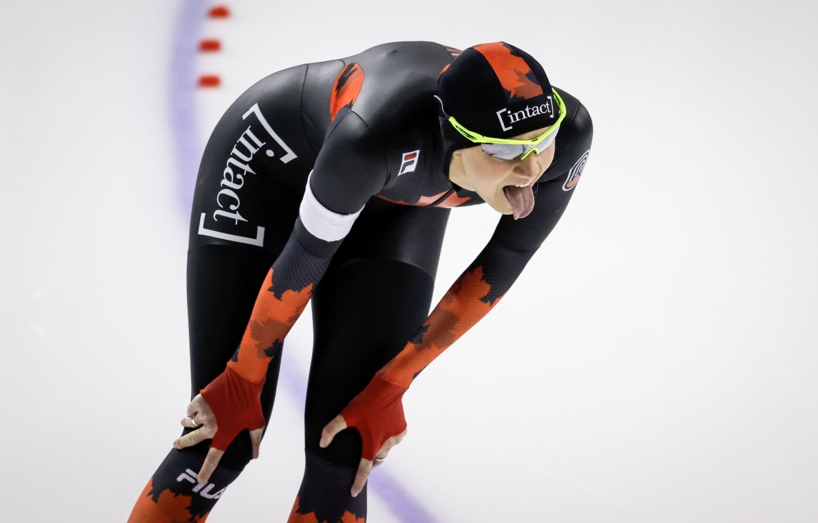 Isabelle Weidemann sticks out her tongue at the end of a speed skating race