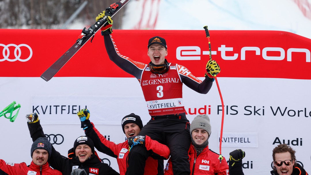 Jeff Read of Team Canada is hoisted into the air by his teammates