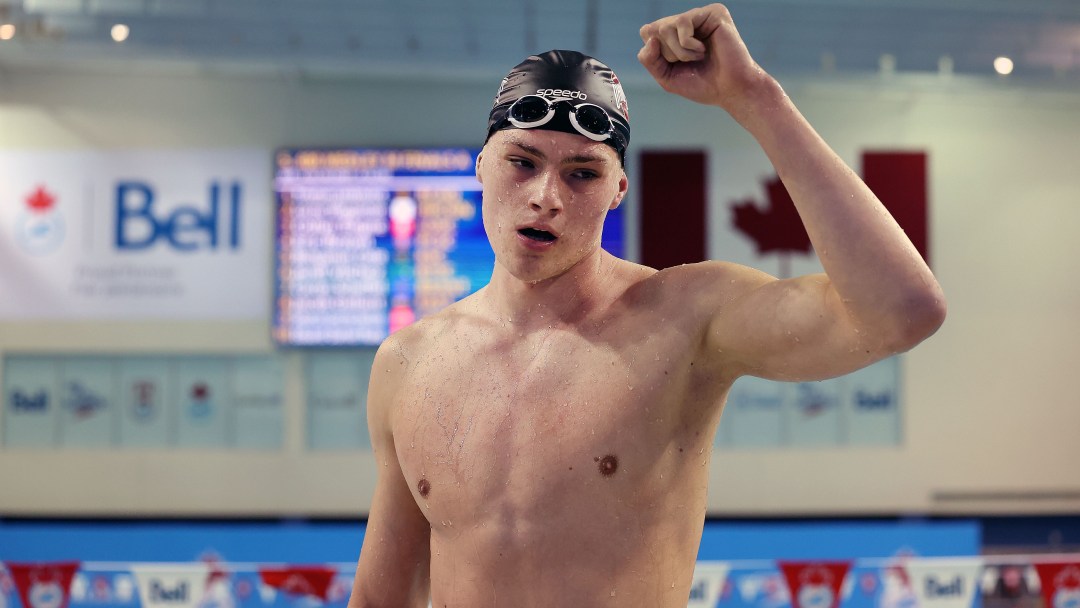 Tristan Jankovics pumps his fist in celebration after winning the 400m IM.