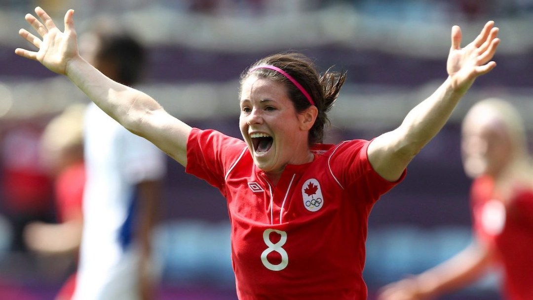 Diana Matheson celebrates after scoring a goal