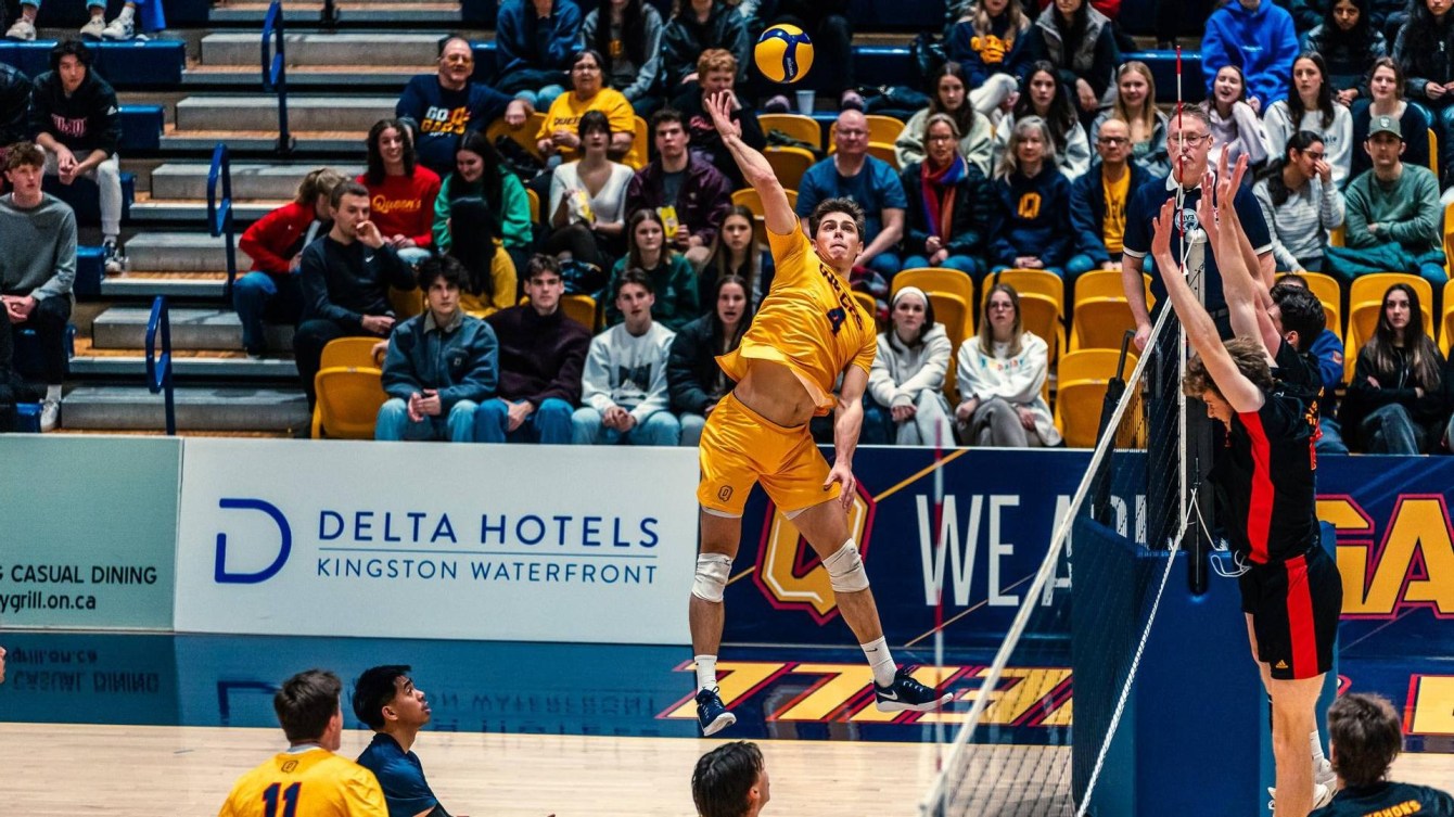 Canadian men's volleyball player Erik Siksna competing with Queen's University. 