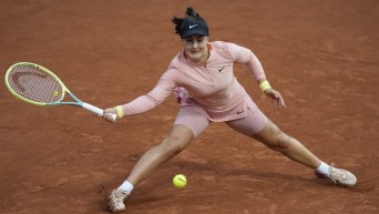 Canada's Bianca Andreescu plays a shot against Italy's Jasmine Paolini during their third round match of the French Open tennis tournament at the Roland Garros stadium in Paris, Saturday, June 1, 2024. (AP Photo/Thibault Camus)