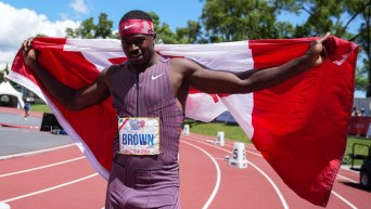 Aaron Brown celebrates as he wins the 200m finals at the Canadian Track and Field Olympic trials in Montreal, Sunday, June 30, 2024. THE CANADIAN PRESS/Christinne Muschi