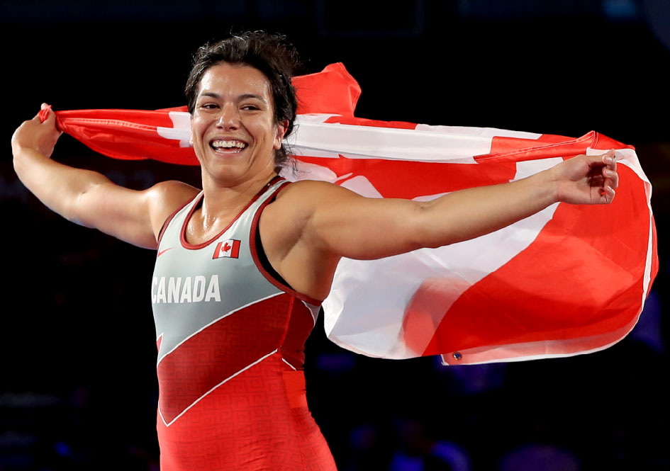 Justina Di Stasio celebrating with a Canadian flag