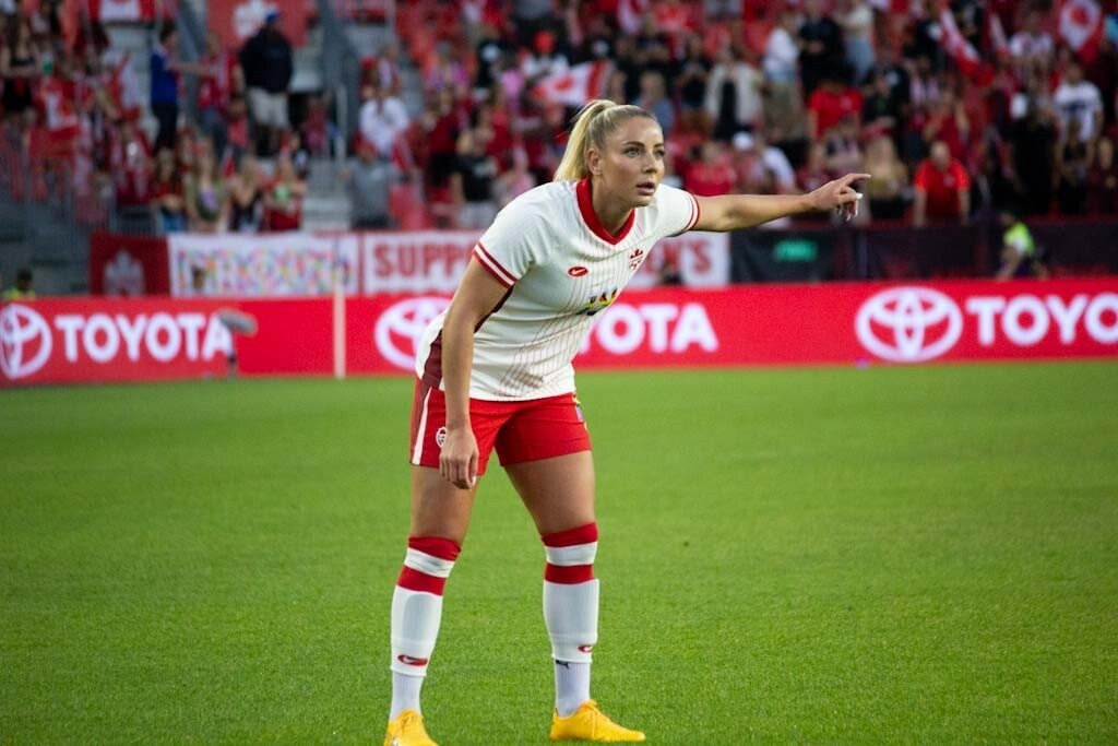 Adriana Leon points to the left during a game.