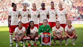 Group shot of the starting eleven players for Canada versus Mexico on June 4, 2024, wearing pride jerseys.