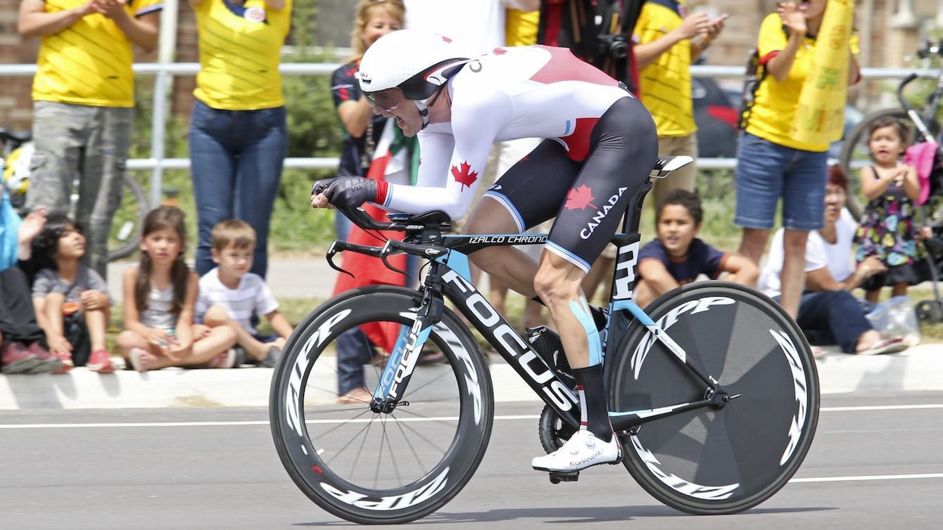 Hugo Houle of Ste-Perpetue, Que. races to gold in the cycling time trial at the Pan American Games in Milton, Ont., Tuesday, July 21, 2015. Photo by Mike Ridewood/COC